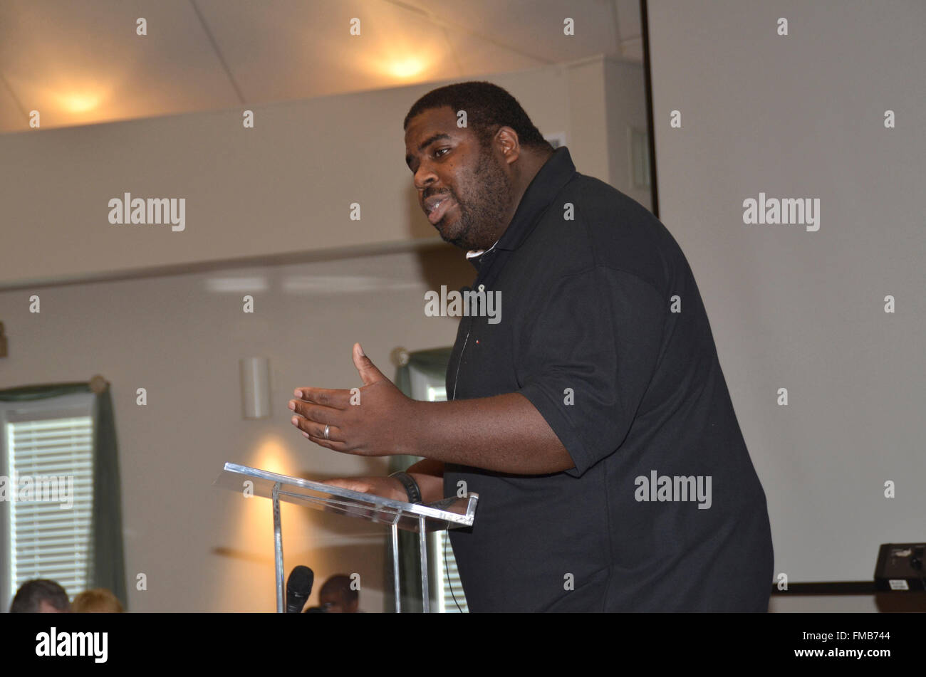 Rapper & preacher Curtis Allen speaks to a church crowd in Riverdale