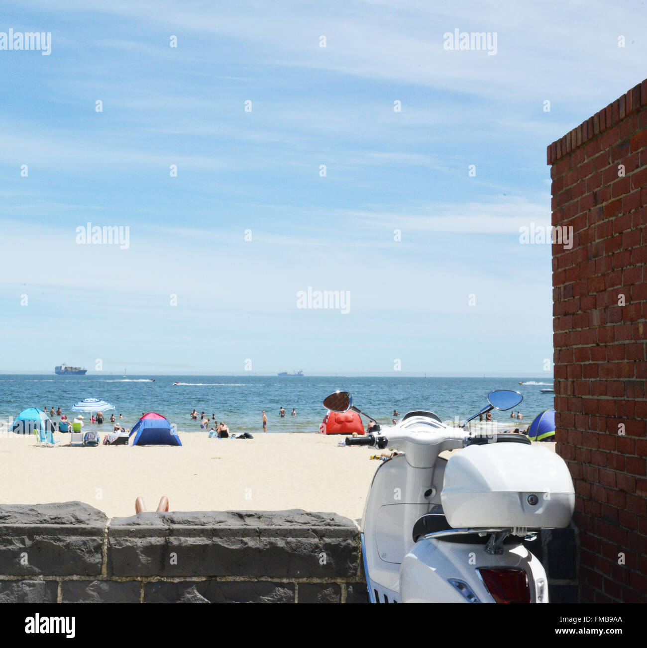 Beach Scene. City Beach with Motorcycle in foreground. Stock Photo