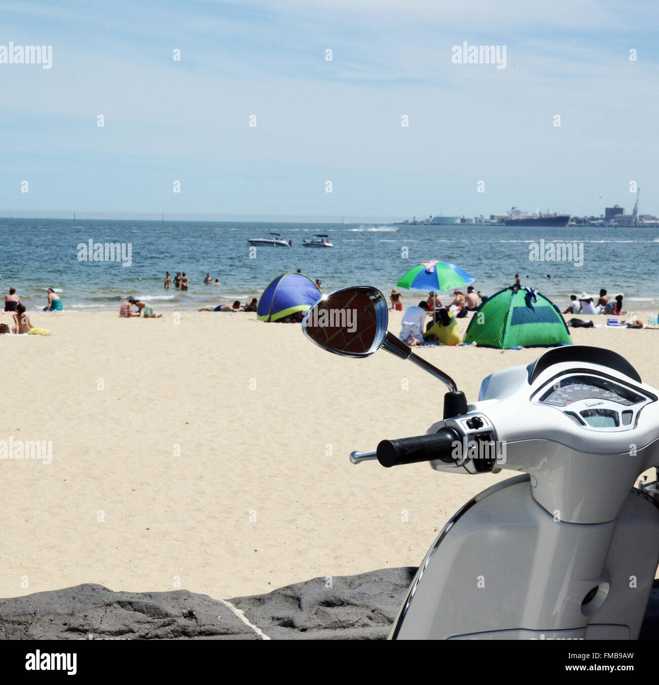 Beach Scene. City Beach with Motorcycle in foreground. Stock Photo