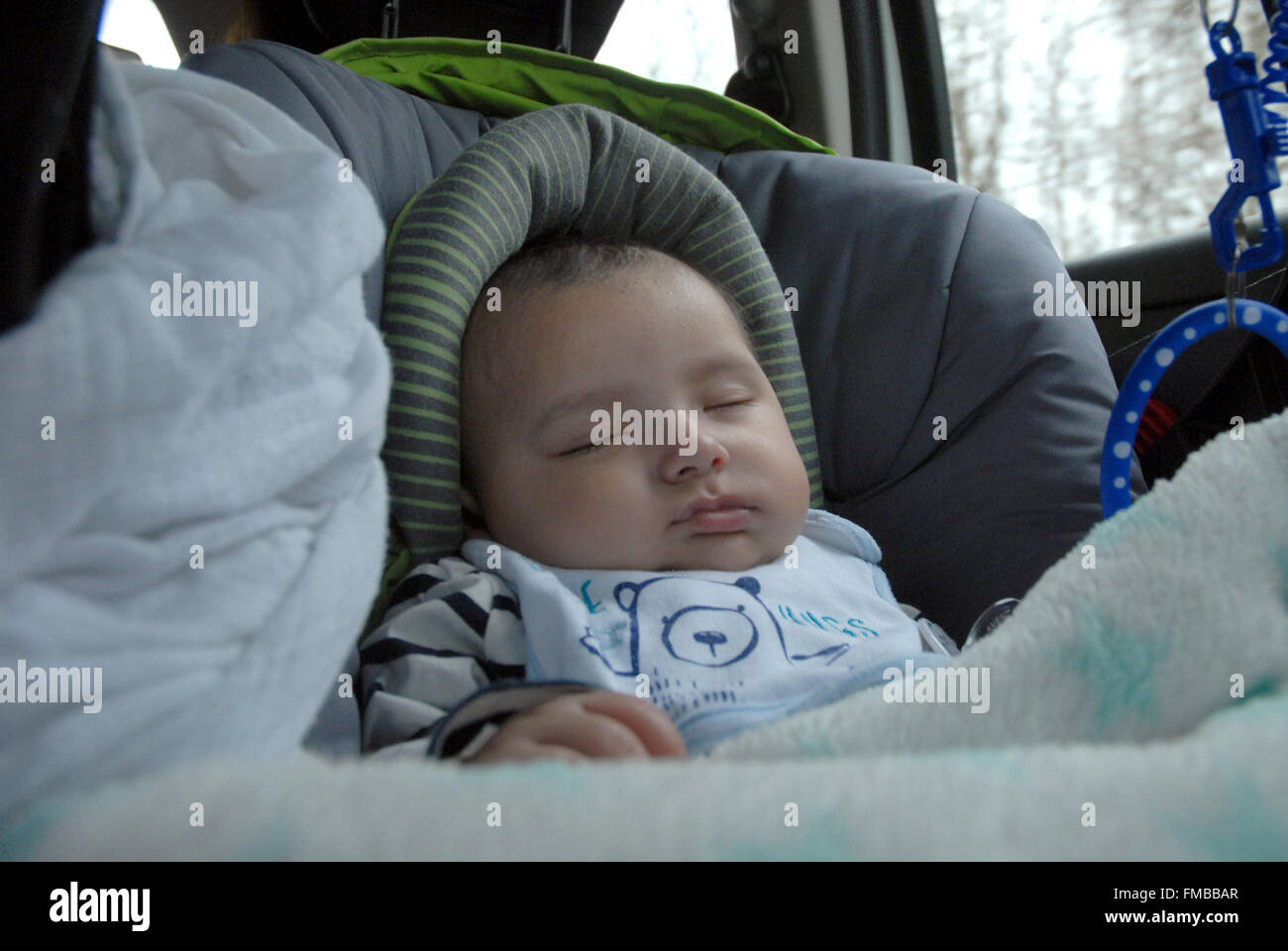 A baby sleeping in a car seat Stock Photo Alamy