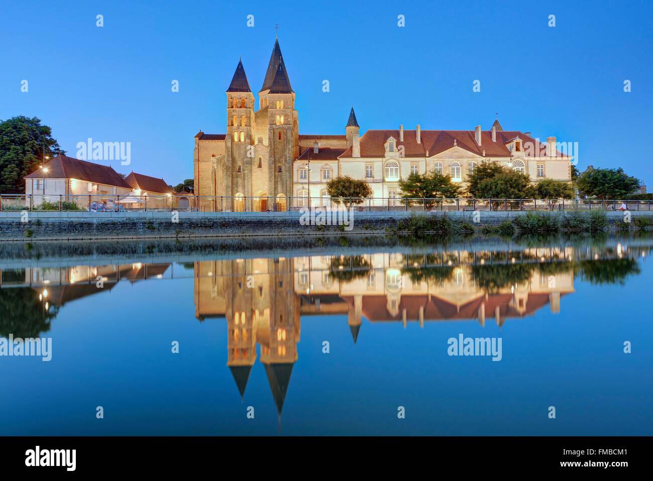 France, Saone et Loire, Paray le Monial, the Sacred Heart basilica and the convent buildings from the banks of the Bourbince Stock Photo
