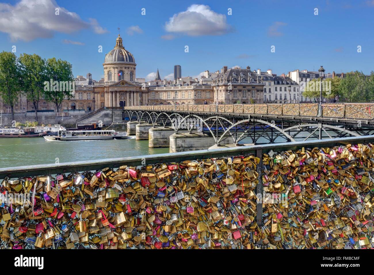 France, Paris, the banks of the Seine river listed as World Heritage by UNESCO and the arts bridge with its love locks Stock Photo