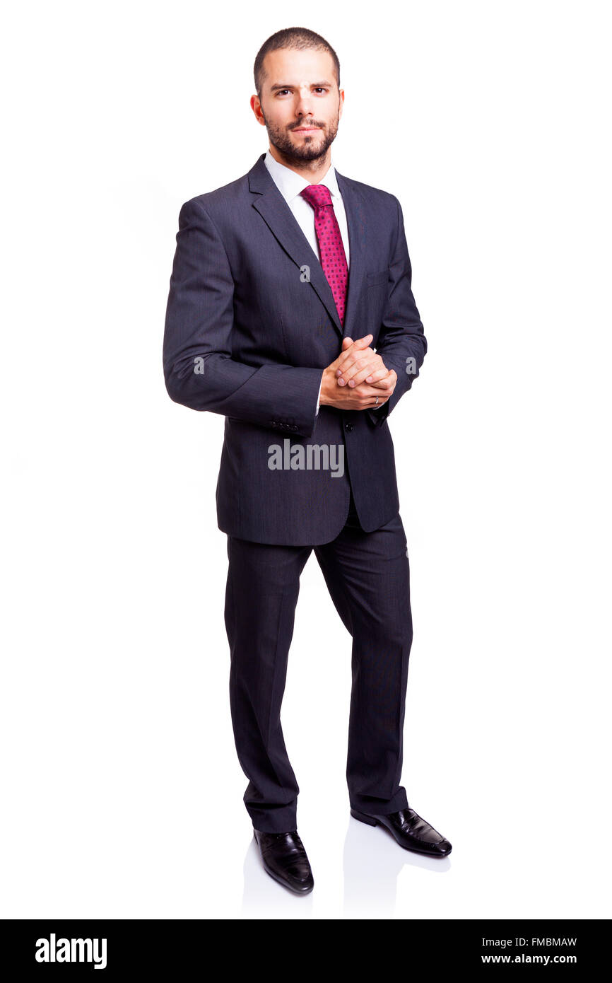 Full lenght portrait of a serious businessman, isolated on white background Stock Photo
