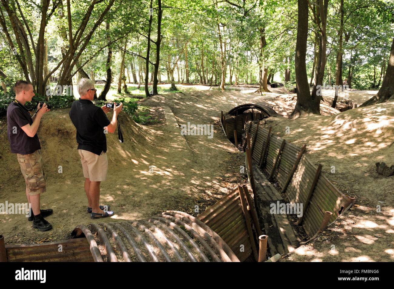 Belgium, West Flanders, Ypres or Ieper, Sanctuary Wood Museum Hill 62, two visitors photographing a trench Stock Photo