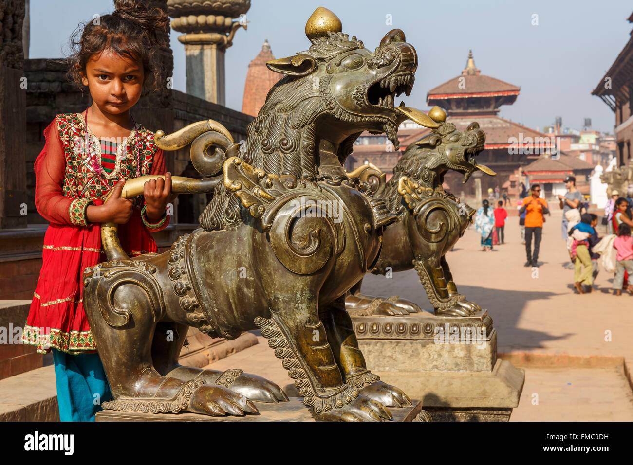Nepal, Bagmati zone, Bhaktapur, listed as World Heritage by UNESCO, girl and bronze statues on Durbar square Stock Photo