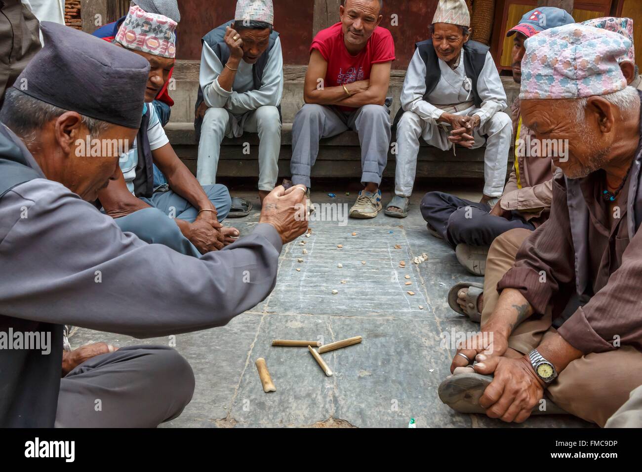Nepal, Bagmati zone, Bhaktapur, men playing a game with pieces of bamboo Stock Photo