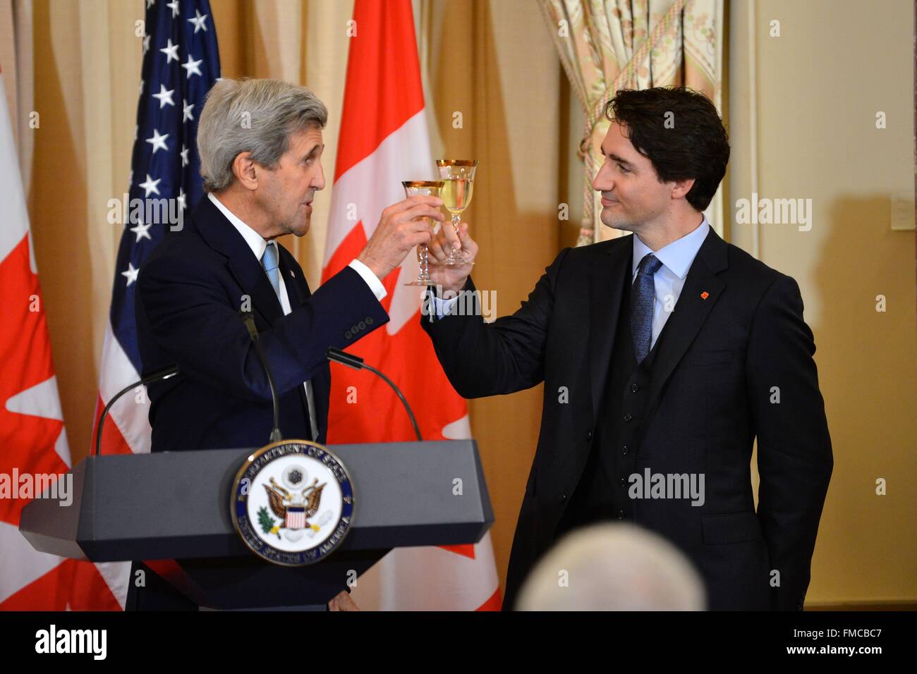 U.S. Secretary of State John Kerry and Canadian Prime Minister Justin Trudeau toast during the State Luncheon in their honor March 10, 2016 in Washington, DC. This is the first state visit by a Canadian Prime Minister in 20-years. Stock Photo