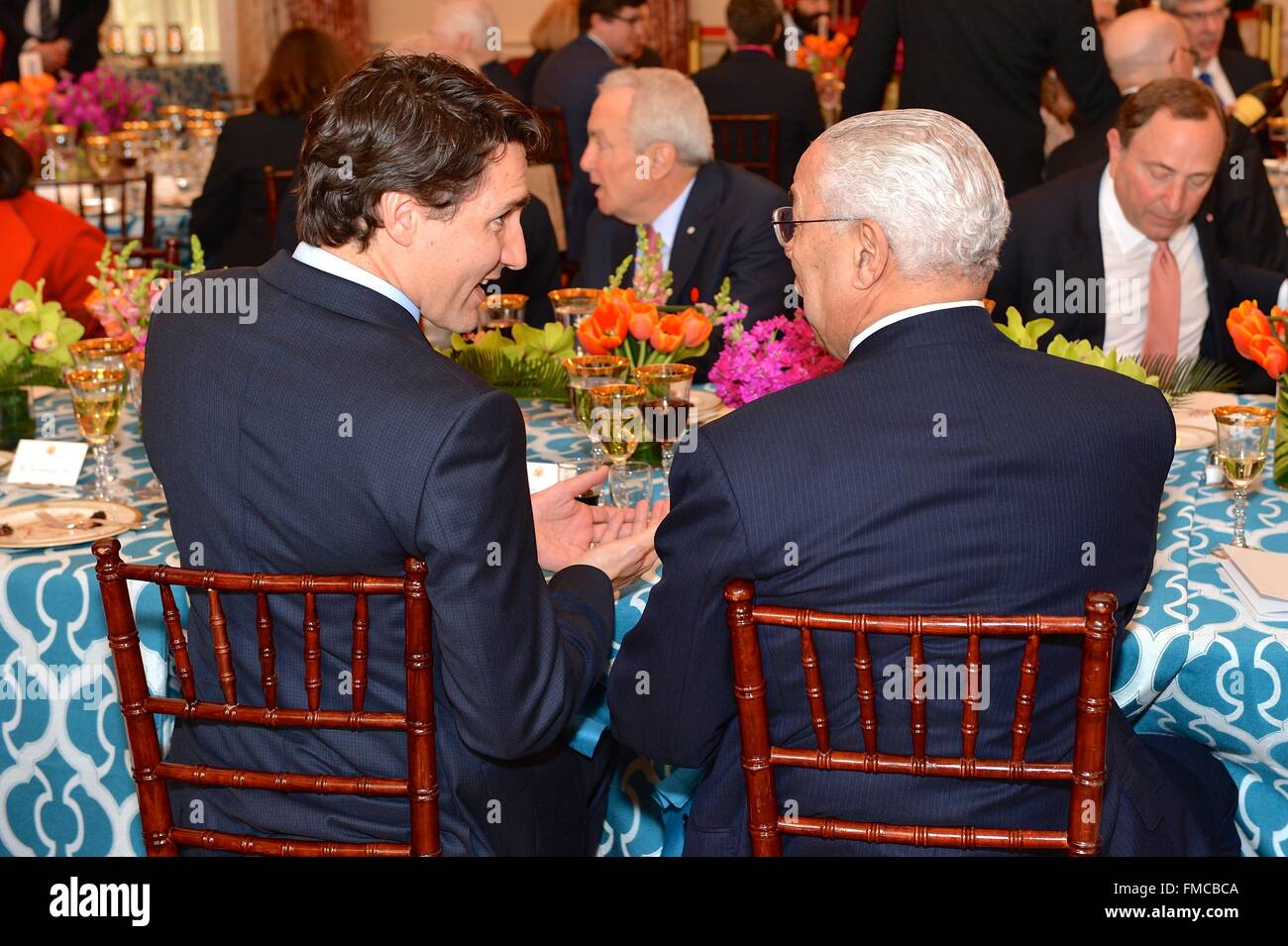 Canadian Prime Minister Justin Trudeau chats with former Secretary of State Colin Powell during a State Luncheon in honor of Trudeau March 10, 2016 in Washington, DC. This is the first state visit by a Canadian Prime Minister in 20-years. Stock Photo