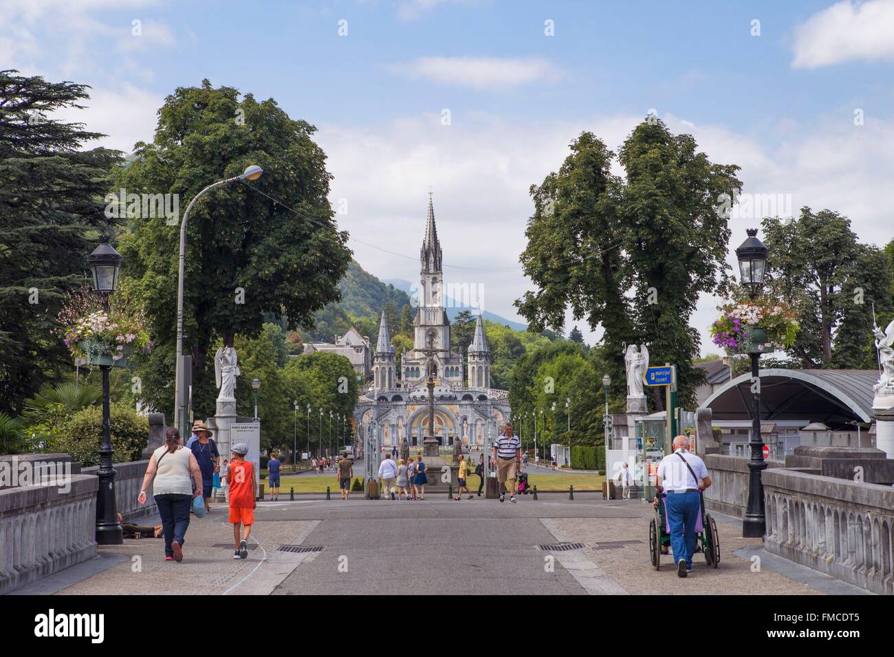 France, Hautes Pyrenees, Lourdes, Sanctuary of Our Lady of Lourdes from the bridge crossing the Gave de Pau Stock Photo