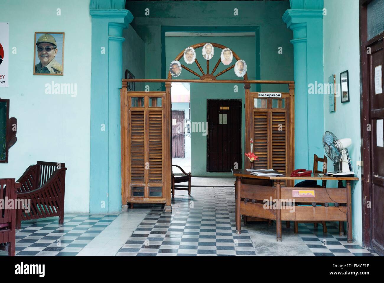Cuba, Camaguey, listed as World Heritage by UNESCO, Entering a hotel with Raul Castro's portrait Stock Photo