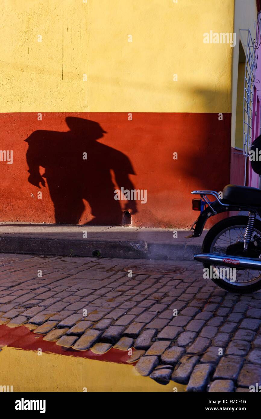 Cuba, Camaguey, listed as World Heritage by UNESCO, Shadows and reflections in a cobbled street Stock Photo