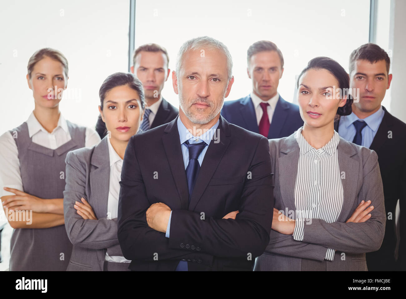 Team of businesspeople posing together Stock Photo - Alamy