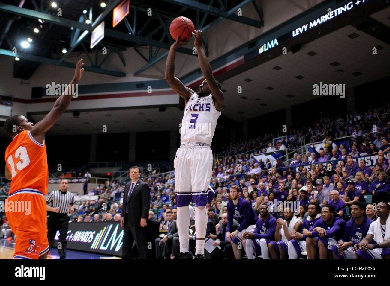 Katy, TX, USA. 11th Mar, 2016. Stephen F. Austin guard Jared Johnson (3) pulls up for a long three-point shot during the men's semifinal game of the Southland Basketball tournament between Stephen F. Austin and Houston Baptist from the Merrell Center in Katy, TX. Credit image: Erik Williams/Cal Sport Media. Credit:  csm/Alamy Live News Stock Photo
