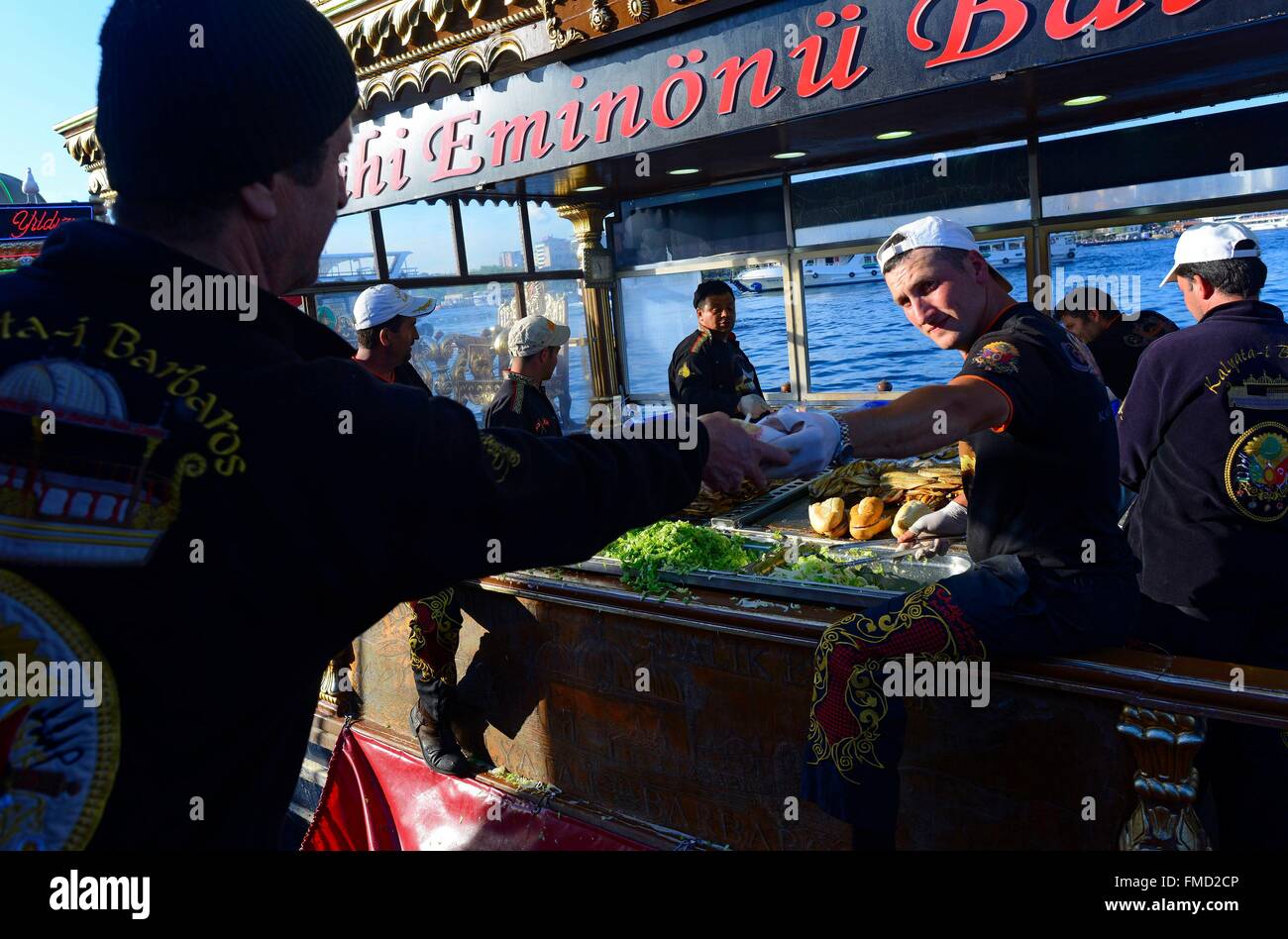 Turkey, Istanbul, Boat of sale of grilled fish sandwiches out on waters of the Golden horn Stock Photo