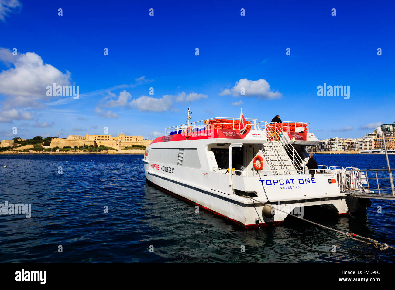 Sliema - Valletta ferry 'Topcat One' waiting to passengers to board at the Valletta pick up. Stock Photo