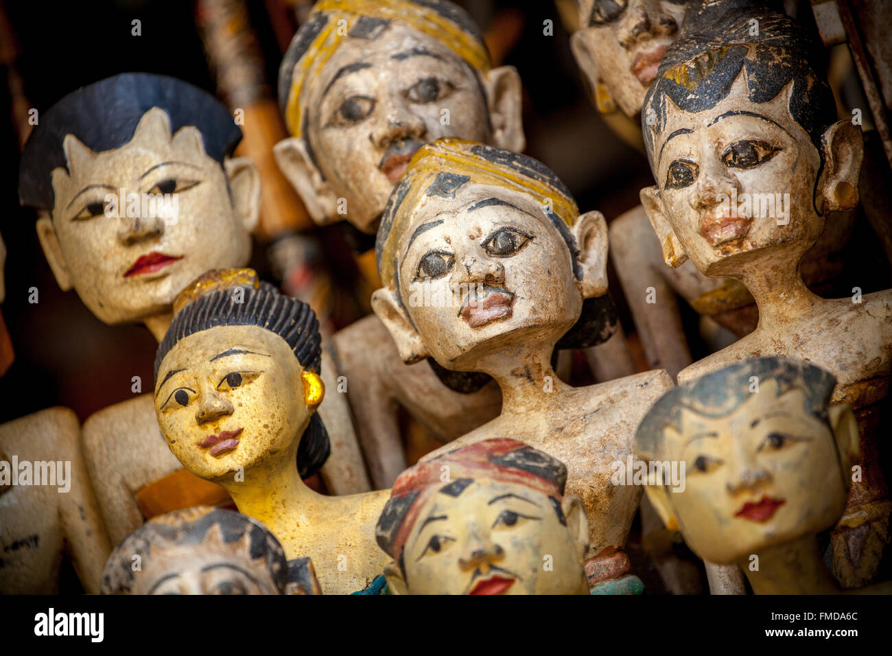 Heads of wooden figures, temple dancers in a bazaar in Ubud, Bali