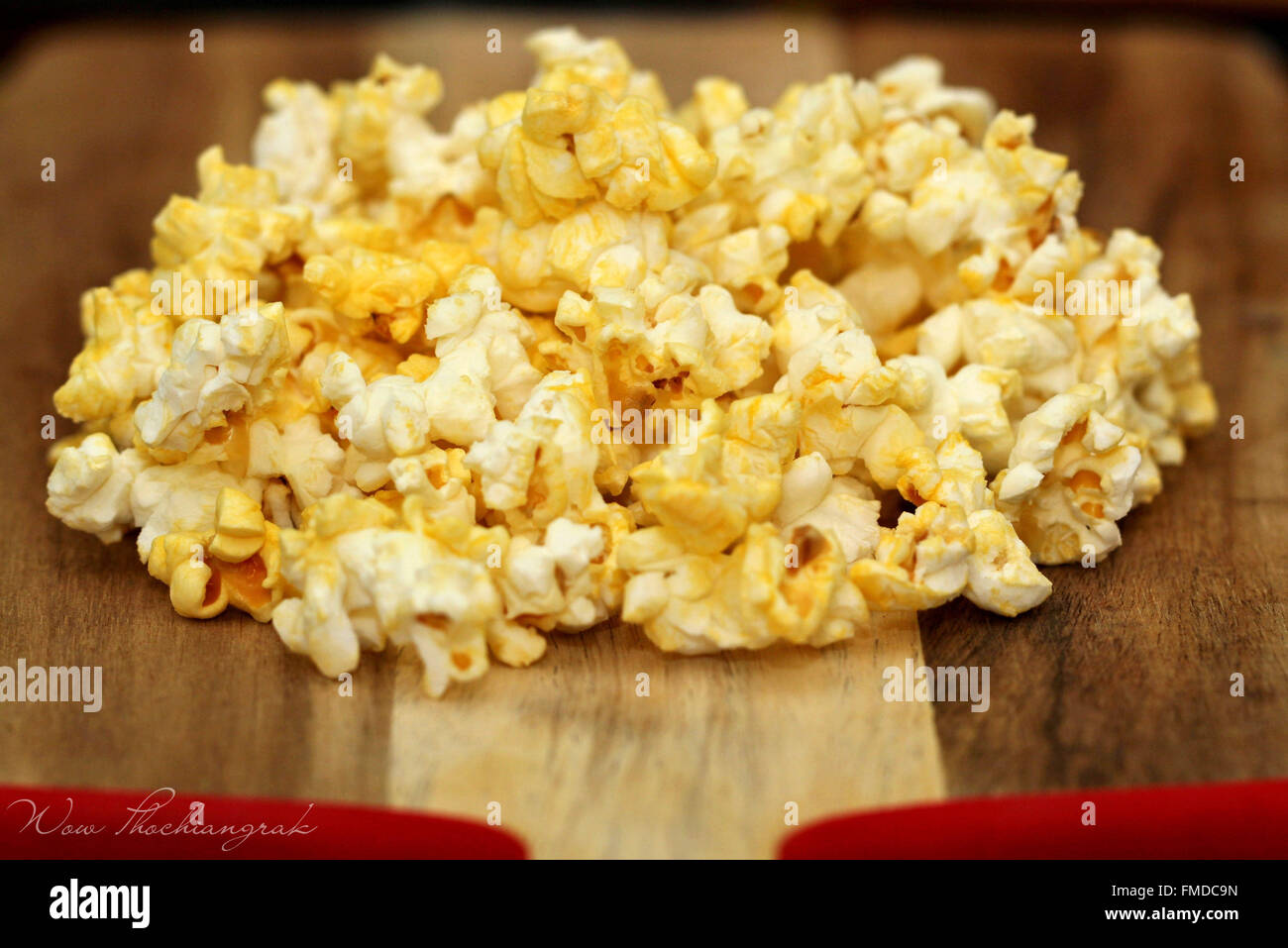 Popped popcorn on wood background Stock Photo