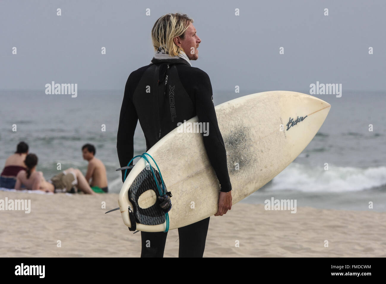 Surfer, in wetsuit,looking,at,waves, with surfboard at. Venice Beach