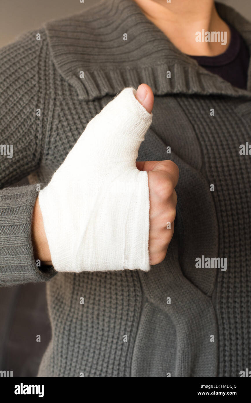 Thumbs up with bandage Stock Photo