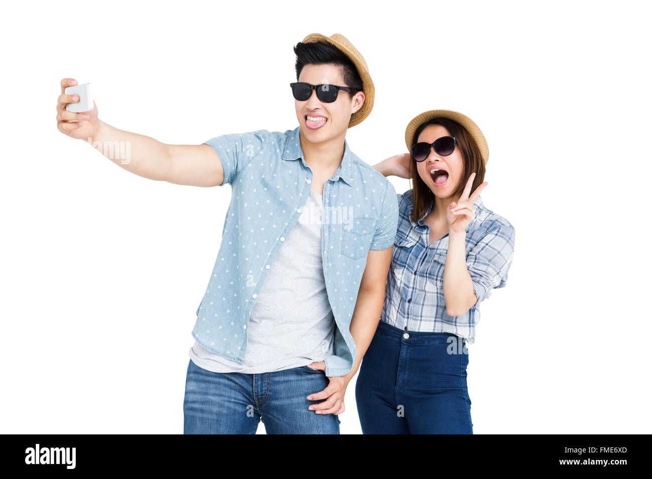 Happy young couple taking a selfie Stock Photo - Alamy