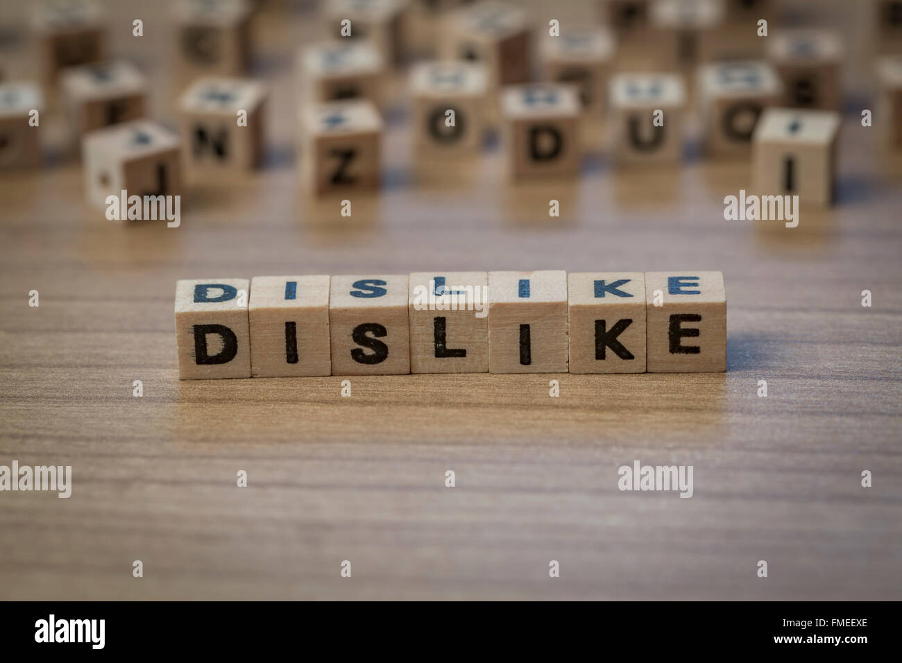 Dislike written in wooden cubes on a table Stock Photo