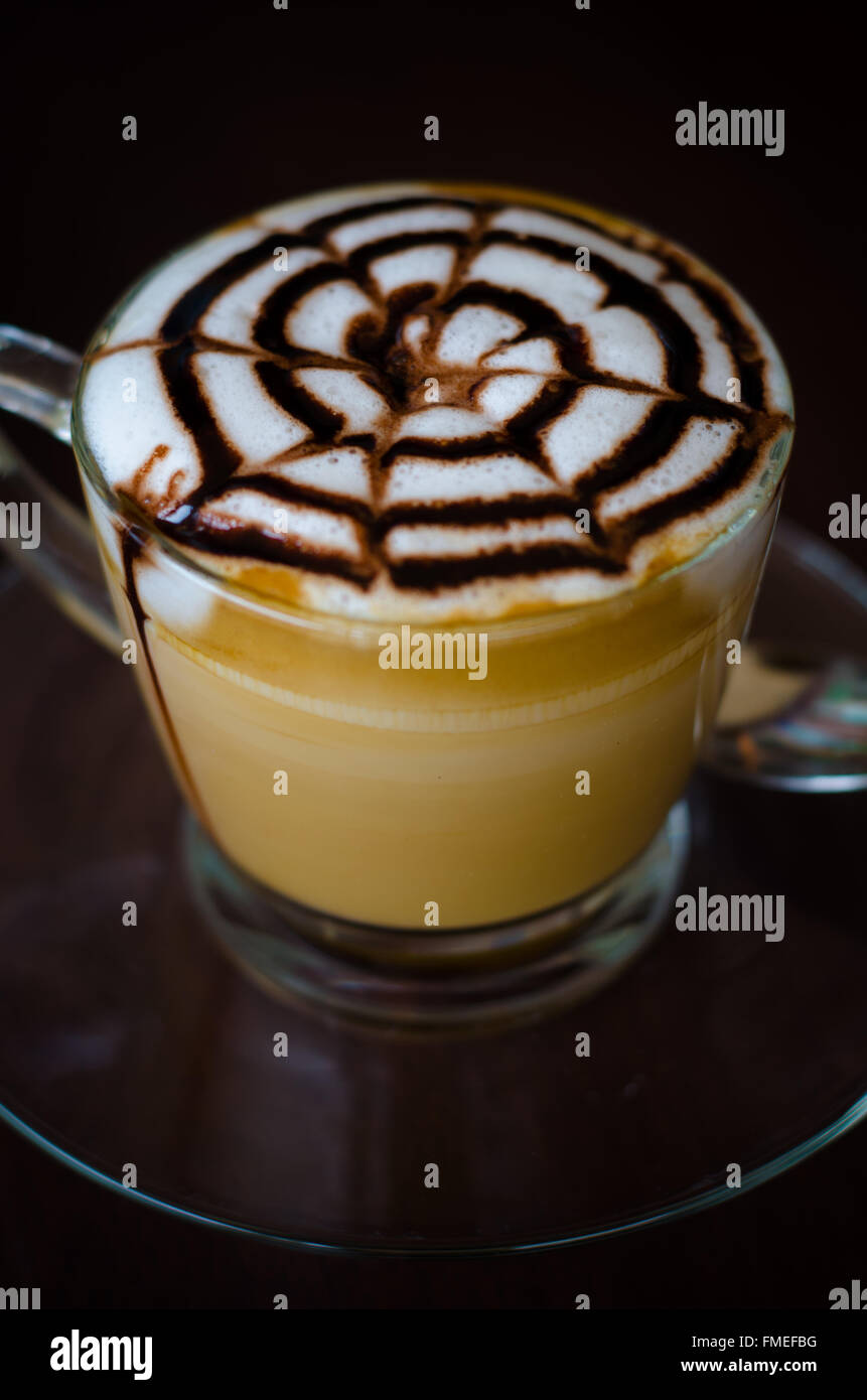 a glass of hot latte art coffee Stock Photo
