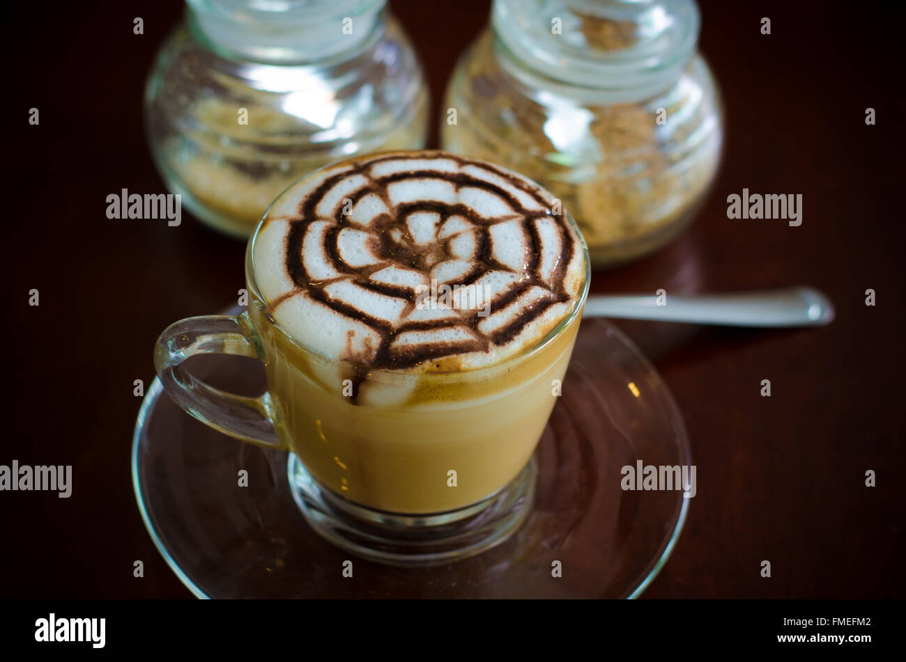 A glass of hot latte art coffee Stock Photo