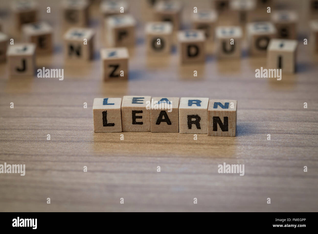 Learn written in wooden cubes on a table Stock Photo