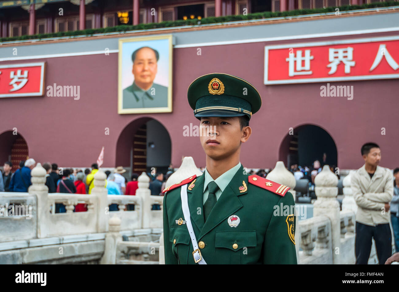 A Chinese soldier stands guard in front of the Gate of Heavenly Peace