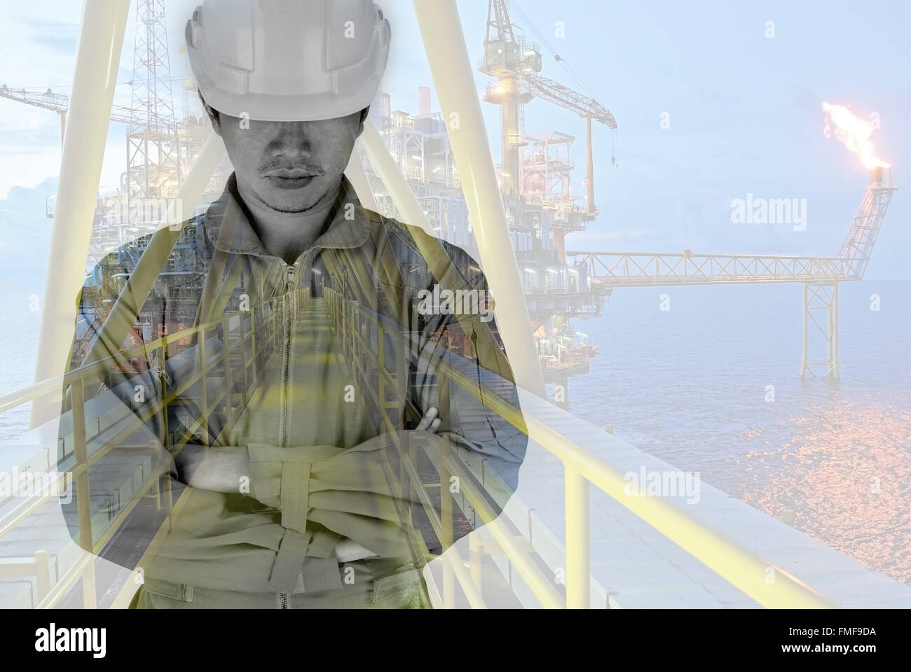 Double exposure of enginee and offshore rig Stock Photo