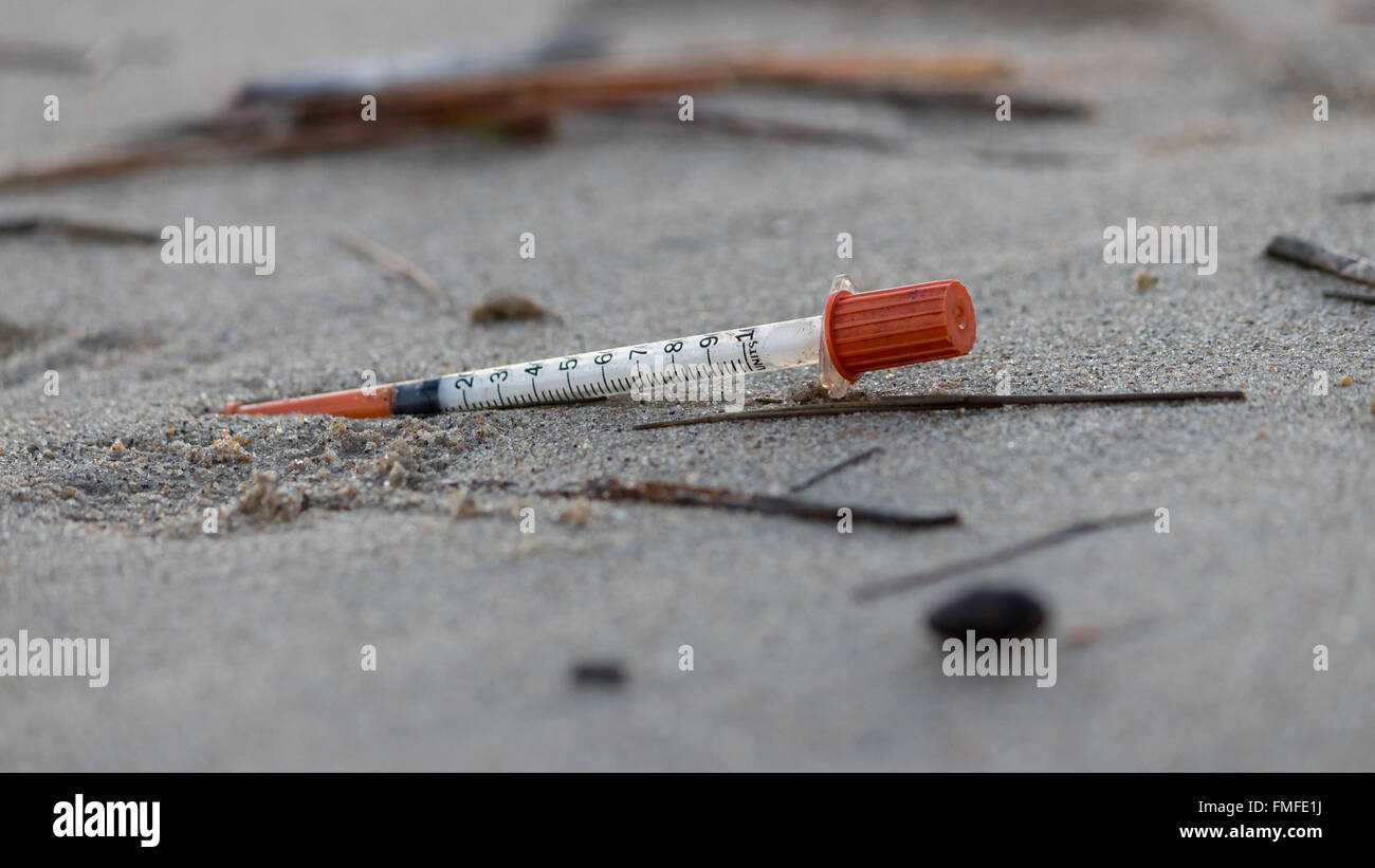 syringe on beach Stock Photo Alamy