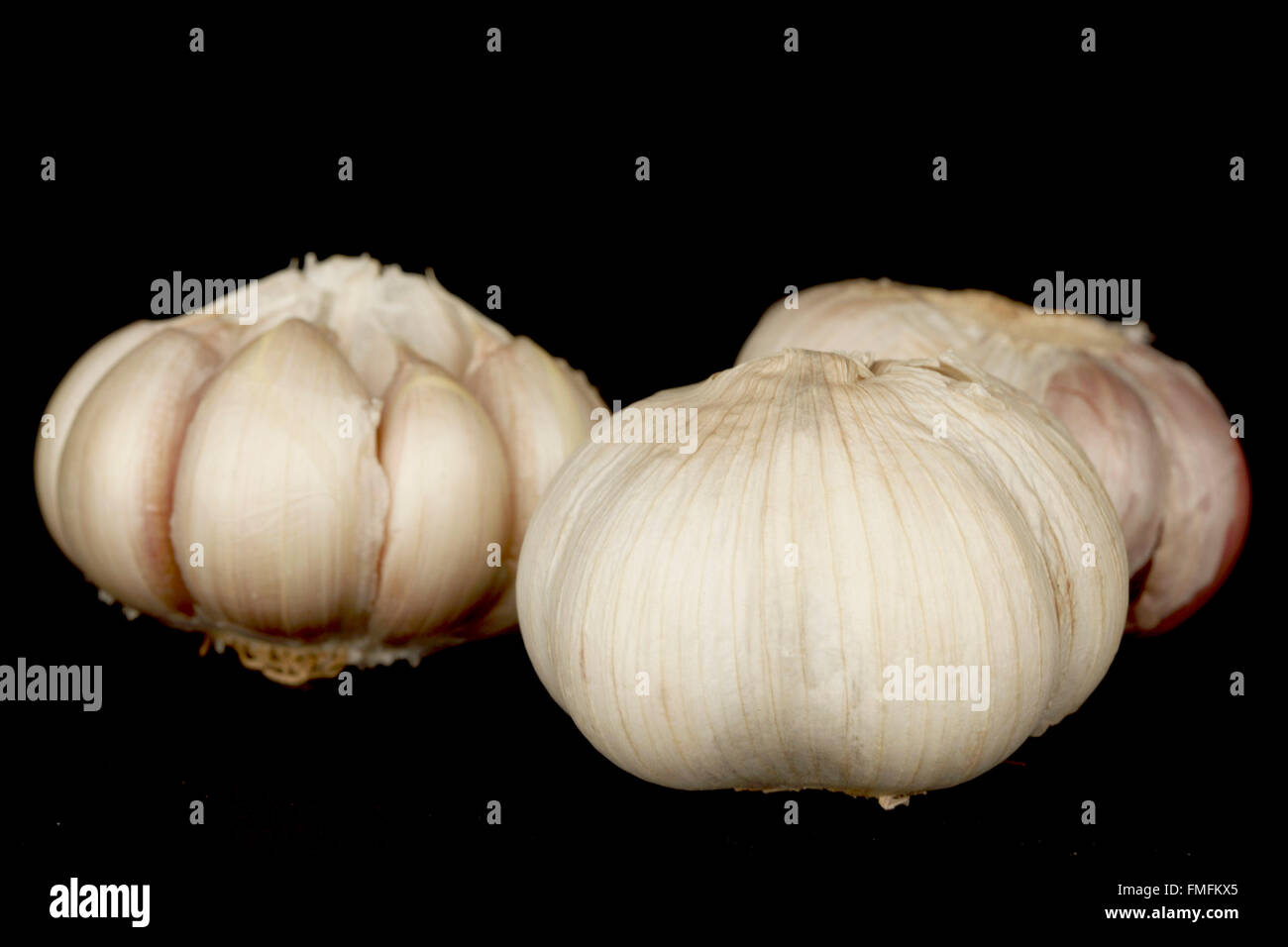 garlic isolated on black background Stock Photo - Alamy