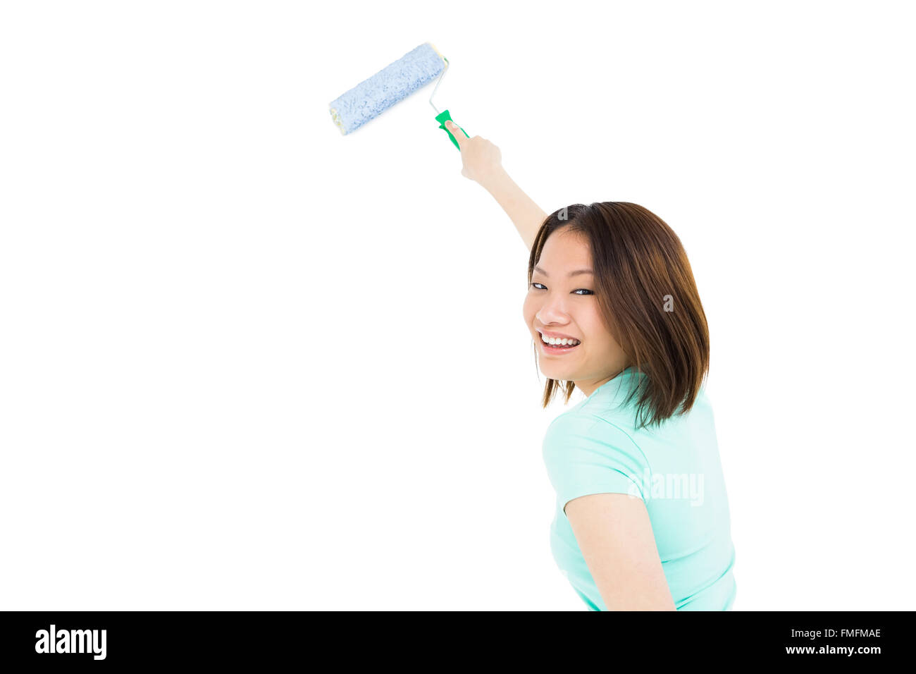 Woman painting with a sponge roller Stock Photo Alamy