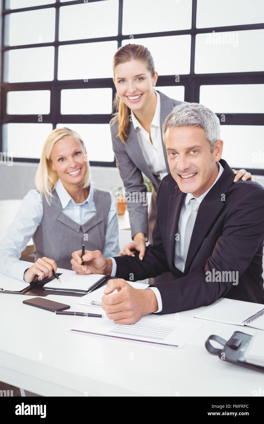 Business people with client in meeting room Stock Photo - Alamy