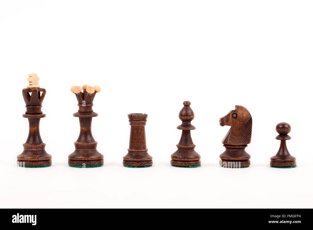 Wooden chess pieces on a white background Stock Photo