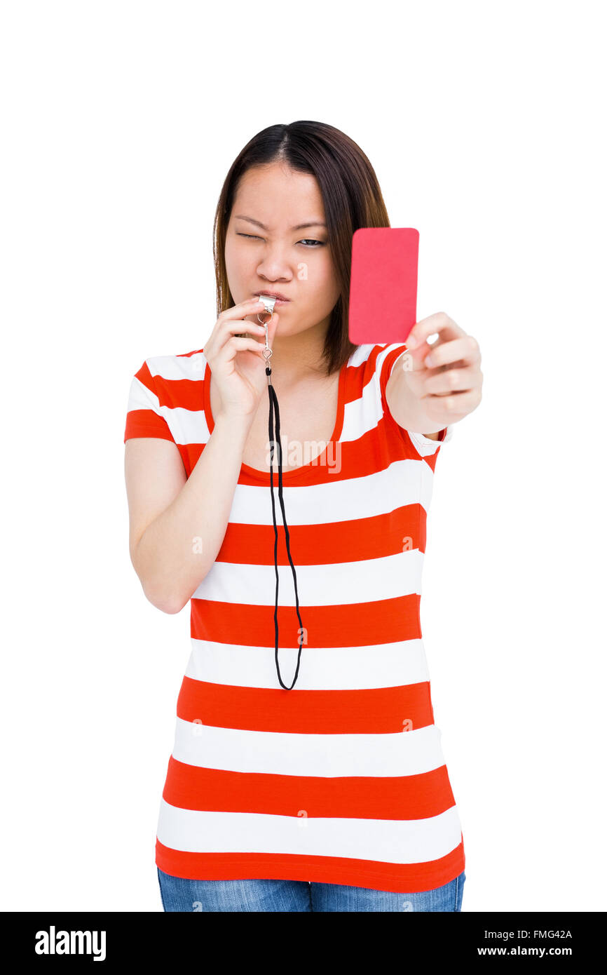 Young woman whistling and showing red card Stock Photo - Alamy