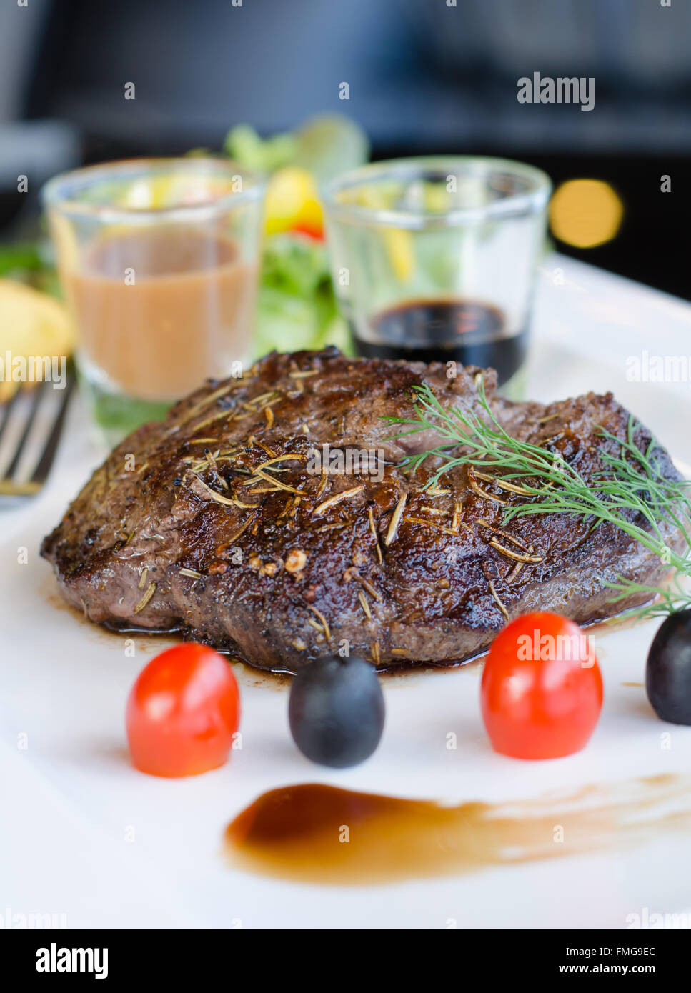 Delicious beef steaks on white plate Stock Photo