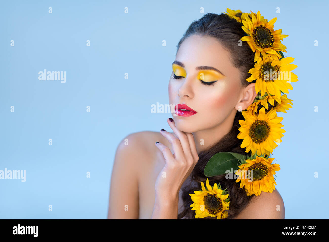 Beautiful girl with flowers in hair Stock Photo - Alamy