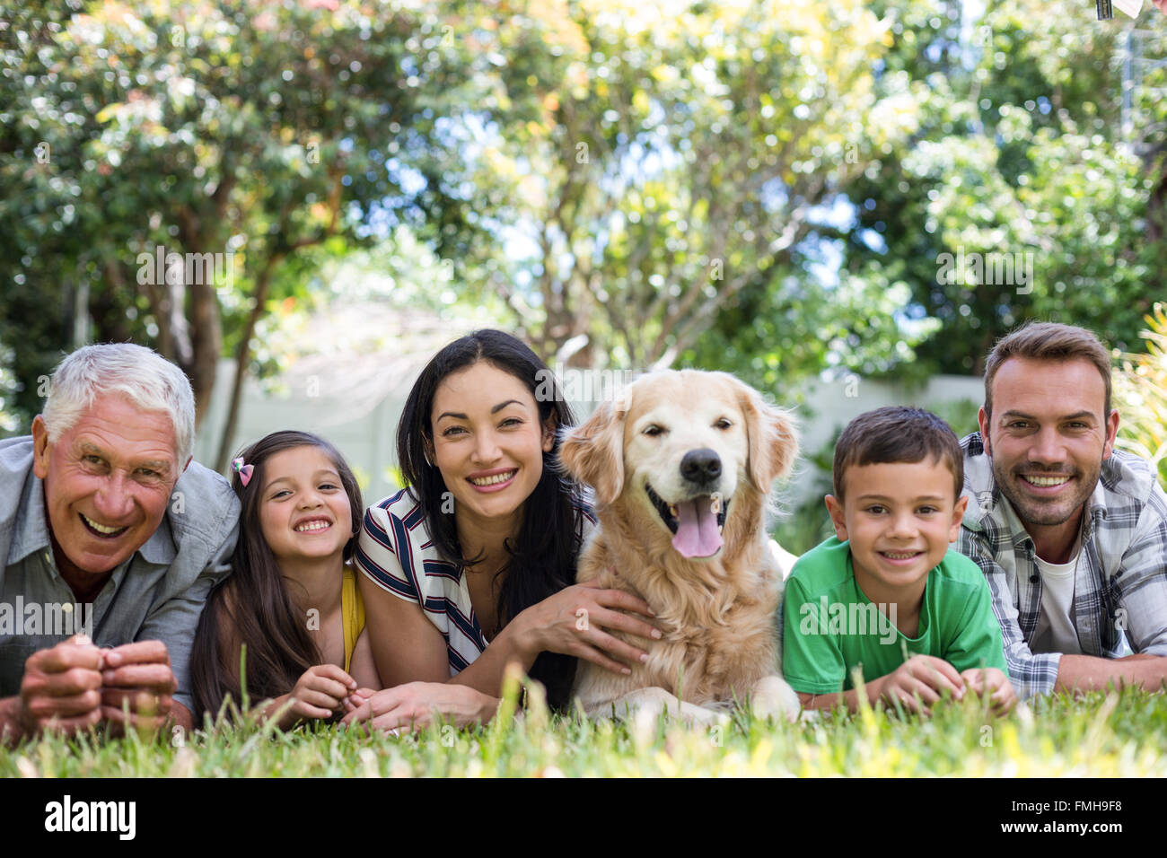 Happy family in a park Stock Photo - Alamy