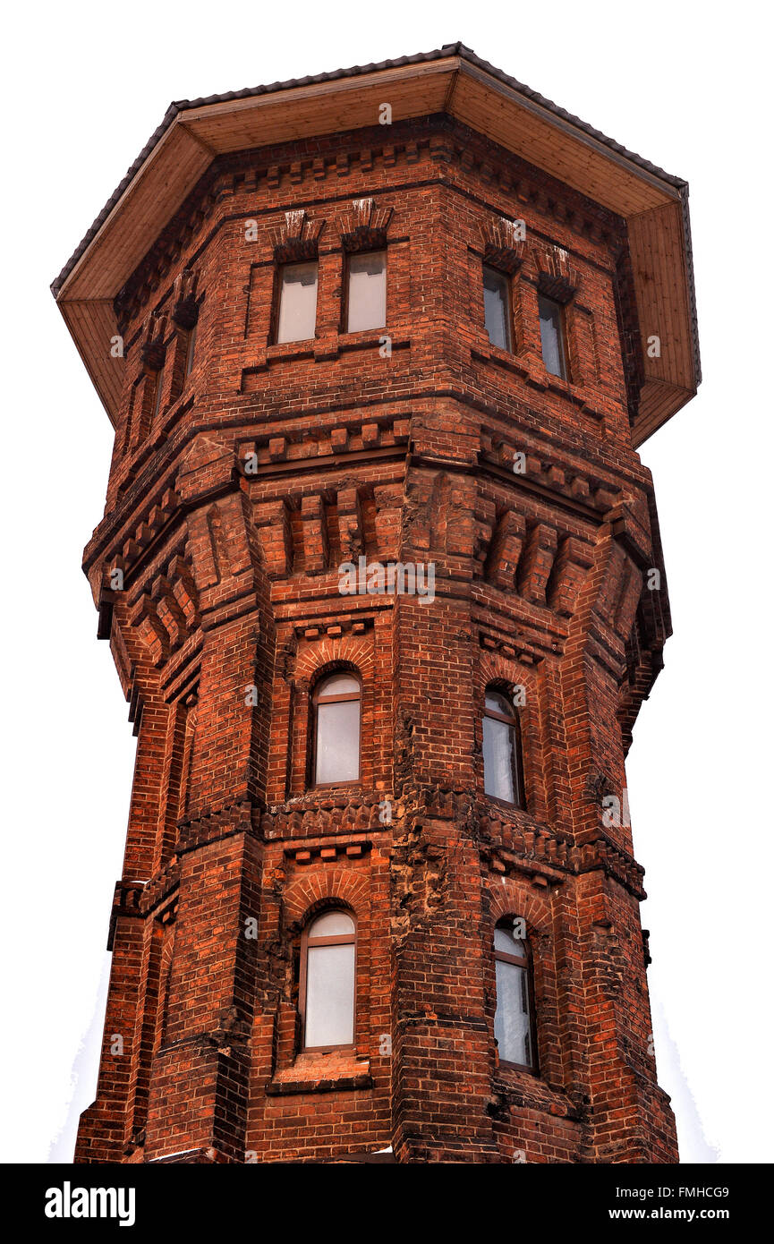 High brick tower isolated on white background. Stock Photo