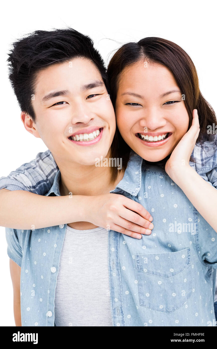 Young couple smiling at the camera Stock Photo - Alamy