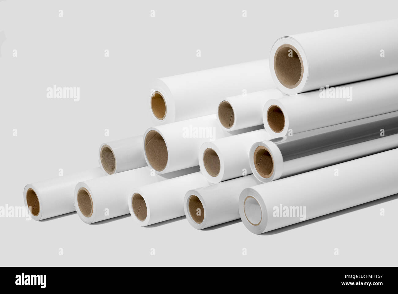 various print media rolls for wide-format printers in light grey back Stock Photo