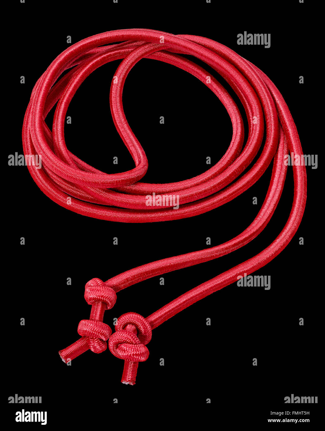 a rolled red rope in black back Stock Photo Alamy