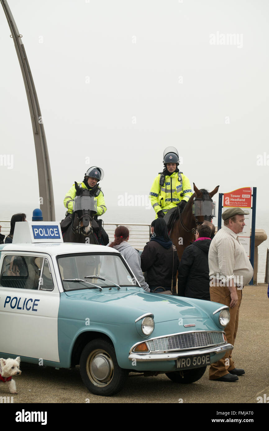 Blackpool,UK, 12th March 2016. Entertainment news. Actor David Lonsdale who plays the 'village fool' David Stockwell in the long running police series 'Heartbeat' promotes the new theatre tour based on the progamme at Blackpool's comedy carpet today. Posing for photograph's with the original police car from the show David speaks to members of the public to highlight this new theatre tour which starts at Blackpool's Grand Theatre on Wednesday the 16th of March. 2016. The nationwide tour finishes at Wolverhampton in July of this year Credit: Gary Telford/Alamy live news Stock Photo