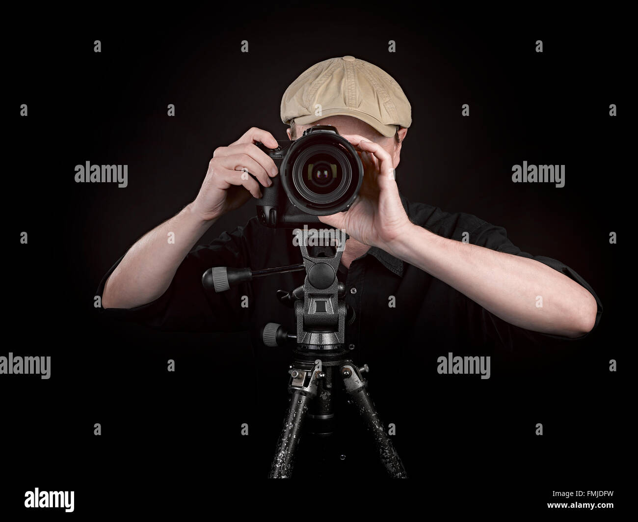 A photographer with a nice camera on black background Stock Photo Alamy