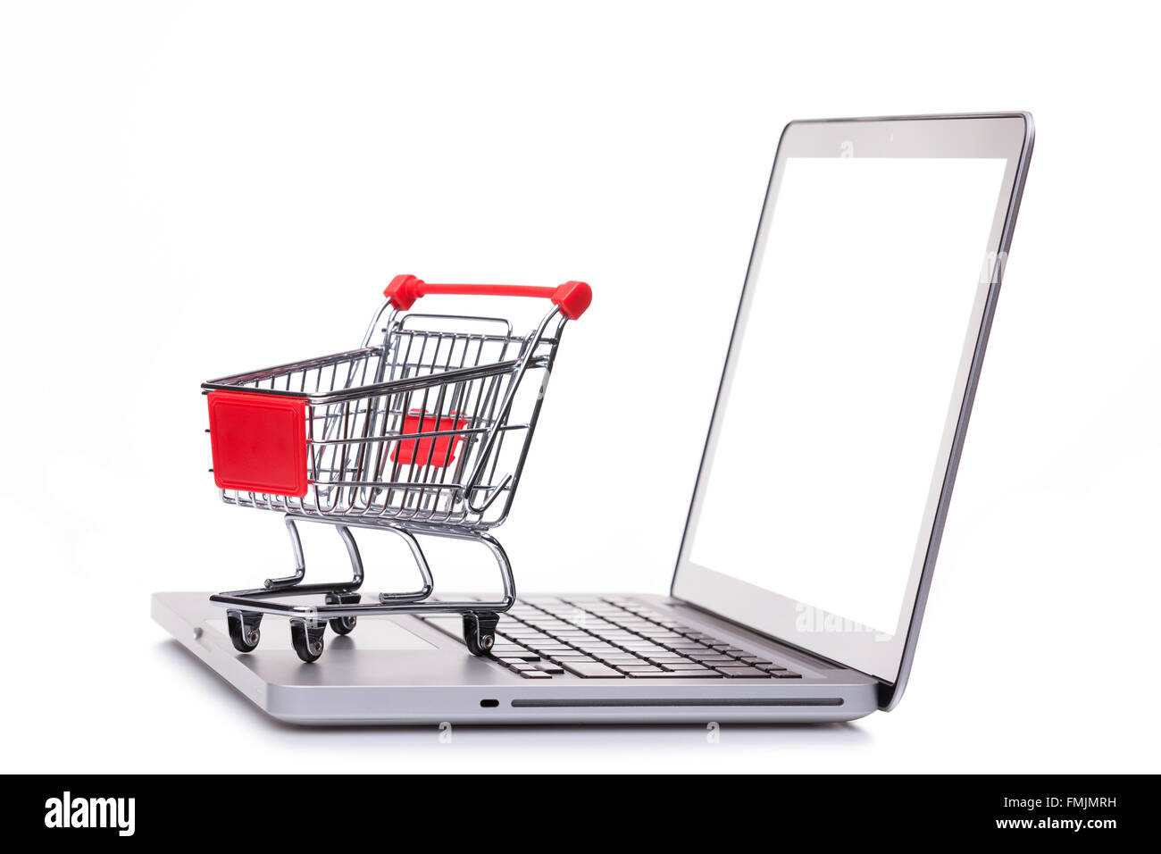 Shopping cart on laptop computer, e-comerce concept Stock Photo