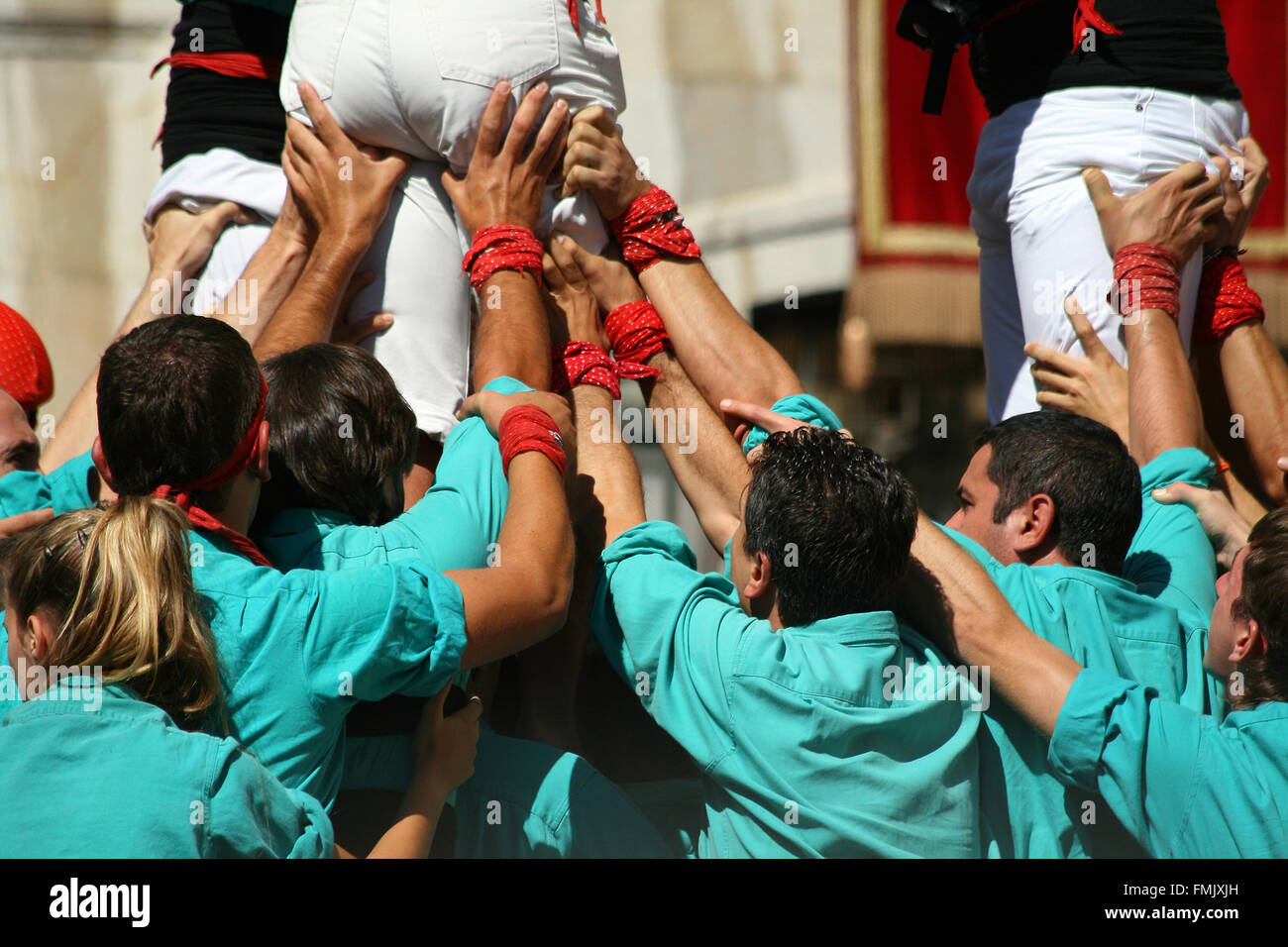 People making human towers, a traditional spectacle in Catalonia called 'castellers' Stock Photo