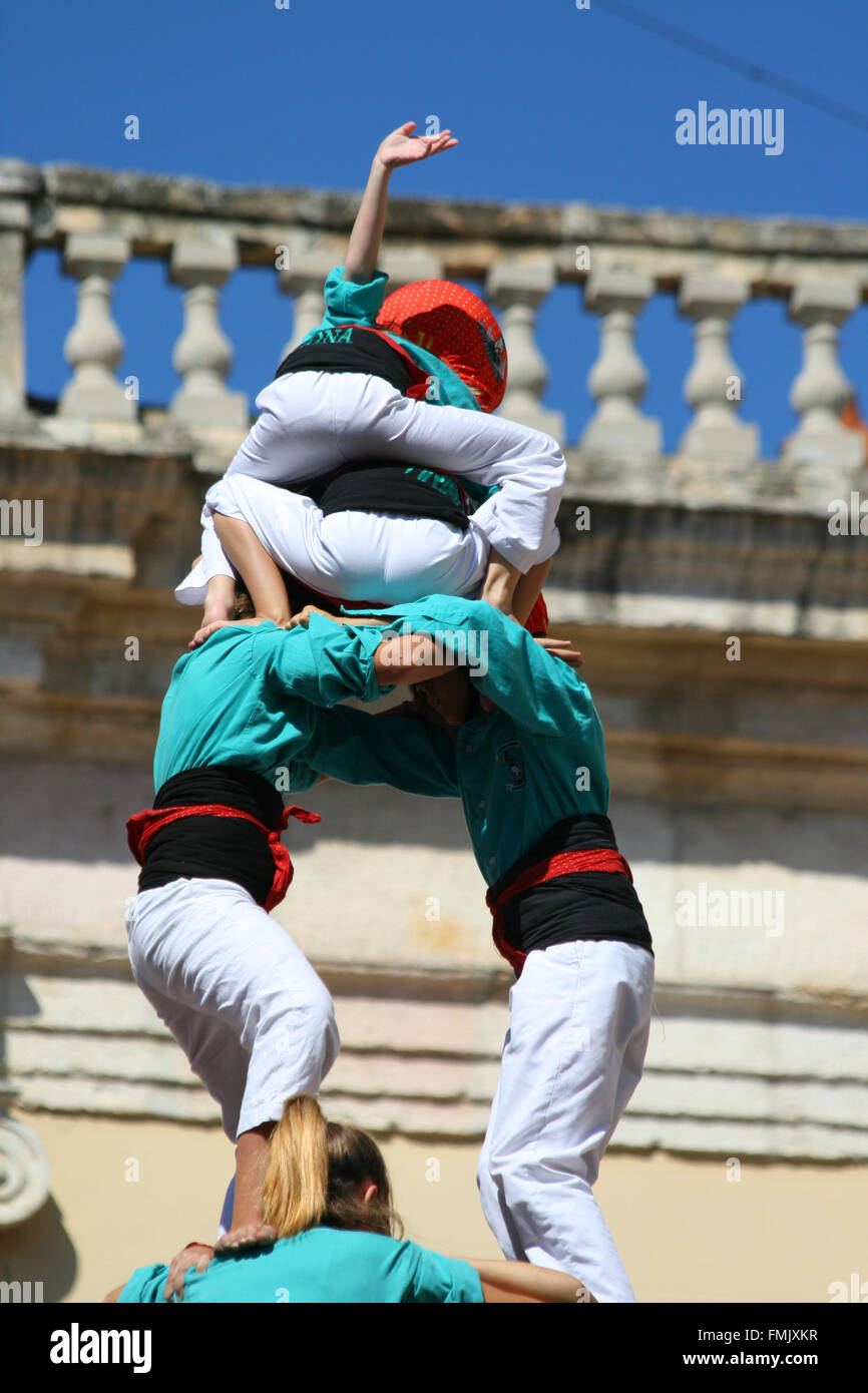 People making human towers, a traditional spectacle in Catalonia called 'castellers' Stock Photo