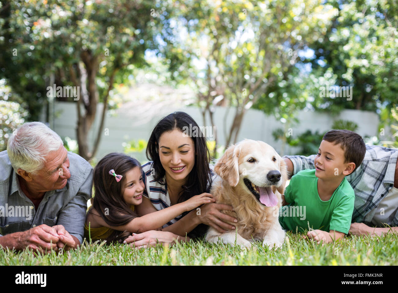 Happy family in a park Stock Photo - Alamy