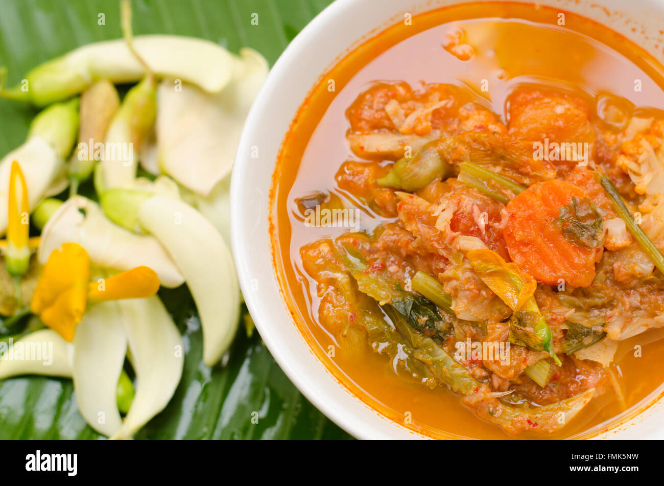 hot and sour curry with tamarind sauce, fish and vegetables : Delicious thai traditional food (kaeng som) Stock Photo